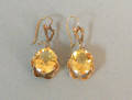 14K yellow gold citrine earrings with buttercup settings and kidney backings