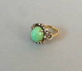14K yellow and white gold turquoise and diamond ring with tall turquoise cabochon and twentyone single cut diamonds