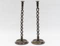 PAIR OF PATINATED BRONZE CANDLESTICKS