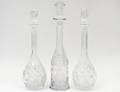 GROUP OF THREE CUT GLASS DECANTERS
