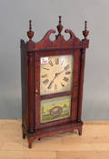 Small mahogany pillar  scroll clock