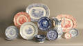 Thirteen pieces of transfer decorated tableware to include two large platters