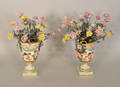 Pair of porcelain urn and bouquet groups