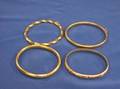 Four 14kt Gold Bangle Bracelets