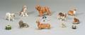 Twelve Small Canine Figurines and Boxes