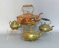 Four brass and copper tea kettles