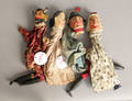 Four carved wood hand puppets