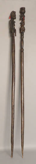 Two carved African staffs