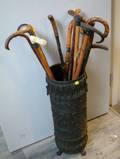 Collection of Seventeen Wooden and Antler Handled Canes and Walking Sticks with a Me Metal Repousse Stand