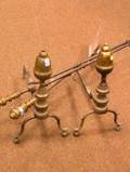 Pair of Brass and Iron Acorntop Andirons and a Twopiece Brass and Iron Hearth Set