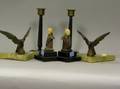 Two Pairs of Art Deco Bookends and a Pair of Brass Mounted Bakelite Candlesticks