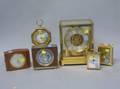 Six Contemporary Brass and Assorted Table Clocks and a Barometer