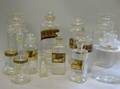 Twelve Gilt Decorated Glass Apothecary Jars Barber Bottles Glass Canisters and Bottles
