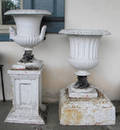 Two cast iron urns