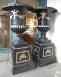 Pair of massive cast iron garden urns