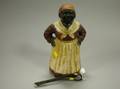 Painted Cast Iron Mammy Doorstop and Implement
