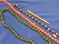 Three Colored Stone Bead Necklaces and a Gold Filled Pencil