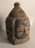 Carved African helmet mask with four faces
