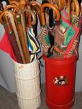 Collection of Approximately Thirtyseven Umbrellas and Walking Sticks in Two Stands