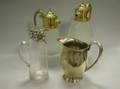 Sterling Silver Pitcher a Pair of Giltmetal Mounted Pressed Glass Carafes and a Si Silver Overlaid Glass Pitcher