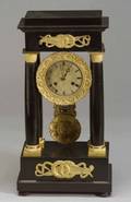 French Empire Revival Ebonized and Parcel Gilt Mantel Clock