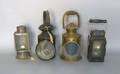 Four tin and brass carry lanterns