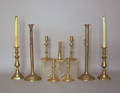 Nine brass candlesticks