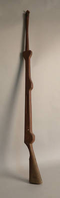Walnut parade torch holder in the form of a gun