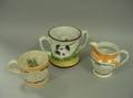 Two Staffordshire Frog Mugs and a Sailing Ship and Motto Jug