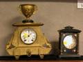 Late Victorian Gilt Decorated Lacquered Cast Iron Carriage Clock and a Seth Thomas Etruscan Revival Gilt Cast Metal Mantel Clock