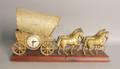 Gilt metal horse and carriage shelf clock by United