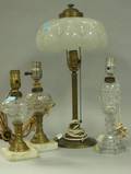 Three Colorless Glass and Brass Fluid Lamps and a Brass Table Lamp with Glass Shade