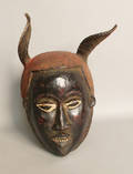 Carved African helmet mask