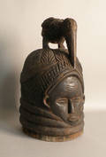 Carved African mask helmet