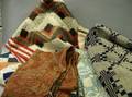 Two Jacquard Woven Coverlets Three Pieced Cotton Coverlets and a Paisley Shawl
