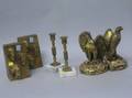 Two Pairs of Giltmetal Patriotic Bookends and a Pair of Brass Candlesticks