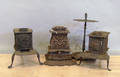 Three cast iron parlor stoves