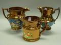 Three English Copper Lustre Ware Pitchers