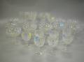 Set of Twentyone Colorless Cut Glass Champagne and Wine Stems