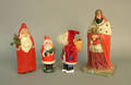Three composition Santa Claus figures