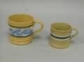 Two Decorated Yellowware Mugs