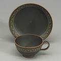 Wedgwood Encaustic Decorated Black Basalt Teacup and Saucer