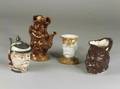 Group of Four Pottery Character Jugs