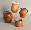 Redware jug with orange and brown glazing
