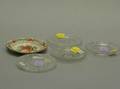 Four Colorless Glass Cup Plates and a Small Painted Queensware Dish