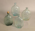 Four aqua blown glass flasks