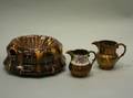 Bennington Glazed Spittoon and Two Copper Lustre Pitchers