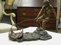 Patinated Cast Bronze Figure of a Fisherman with Netted Fish