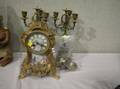 ThreePiece French Rococostyle Giltmetal and Handpainted Porcelain Clock Garniture Set