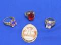 Three Gold and Gemstone Rings and a Cameo Pendant